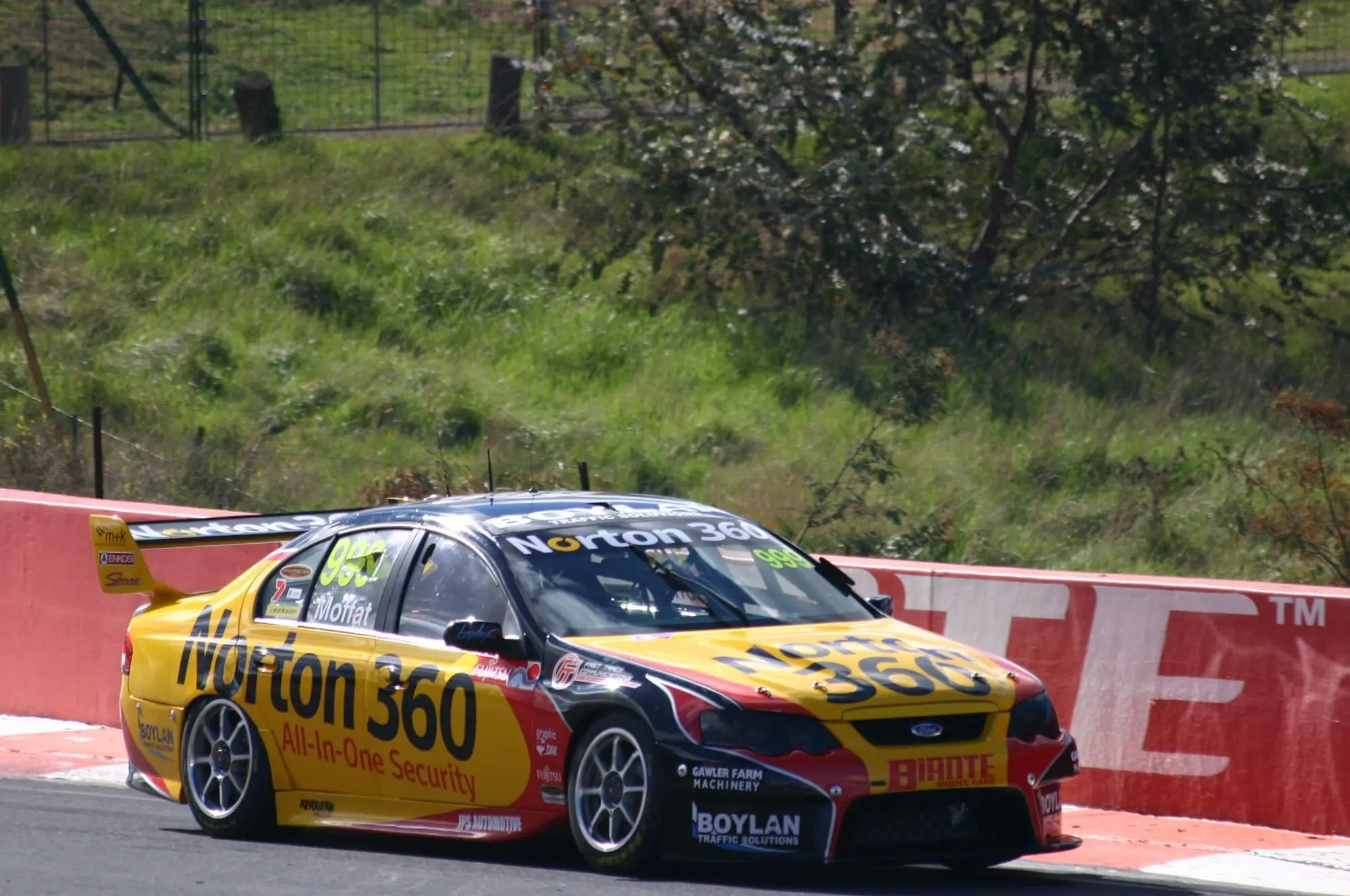 Ford Falcon FG V8 Supercar riding the kerb at Mount Panorama, Bathurst