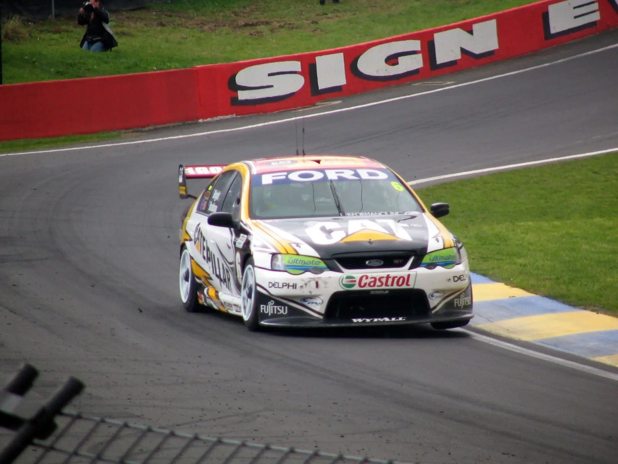 Ford Falcon BF V8 Supercar cornering hard at Mount Panorama during the Bathurst 1000