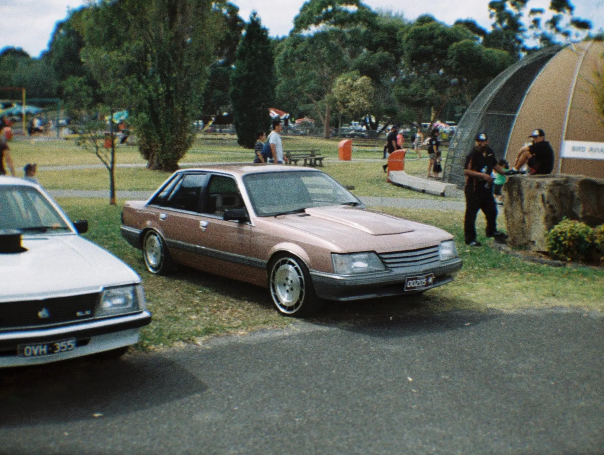 Holden VK Commodore sedan parked on the grass at an Aussie car show